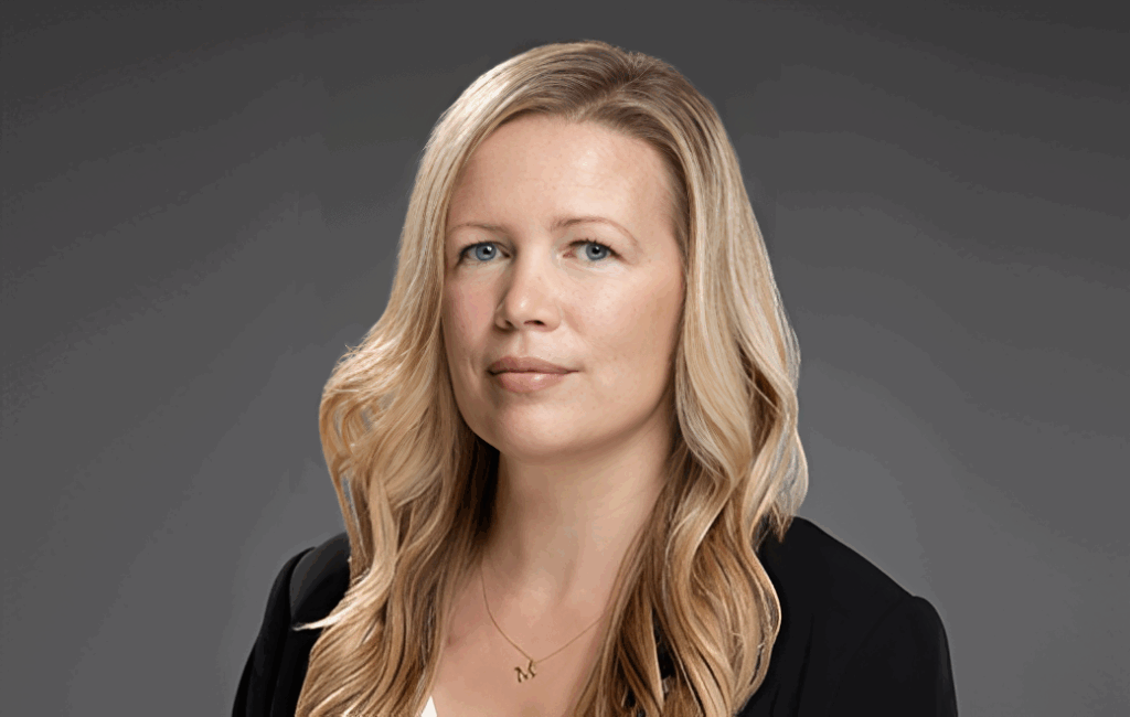 Portrait of a confident woman with blonde hair.
